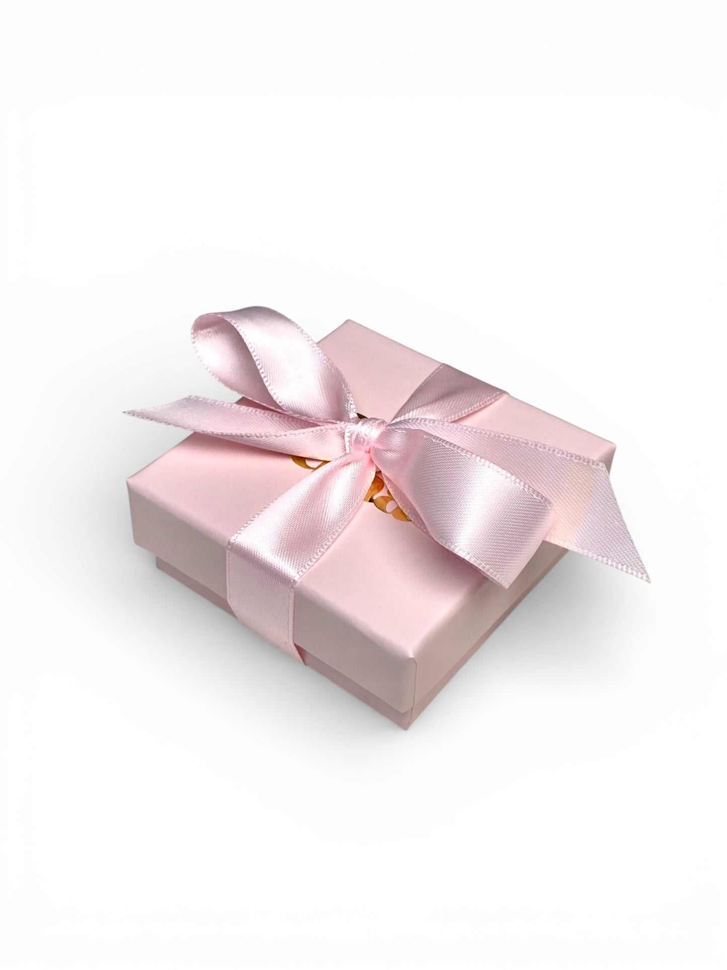 Vaaleanpunainen korurasia rusetilla