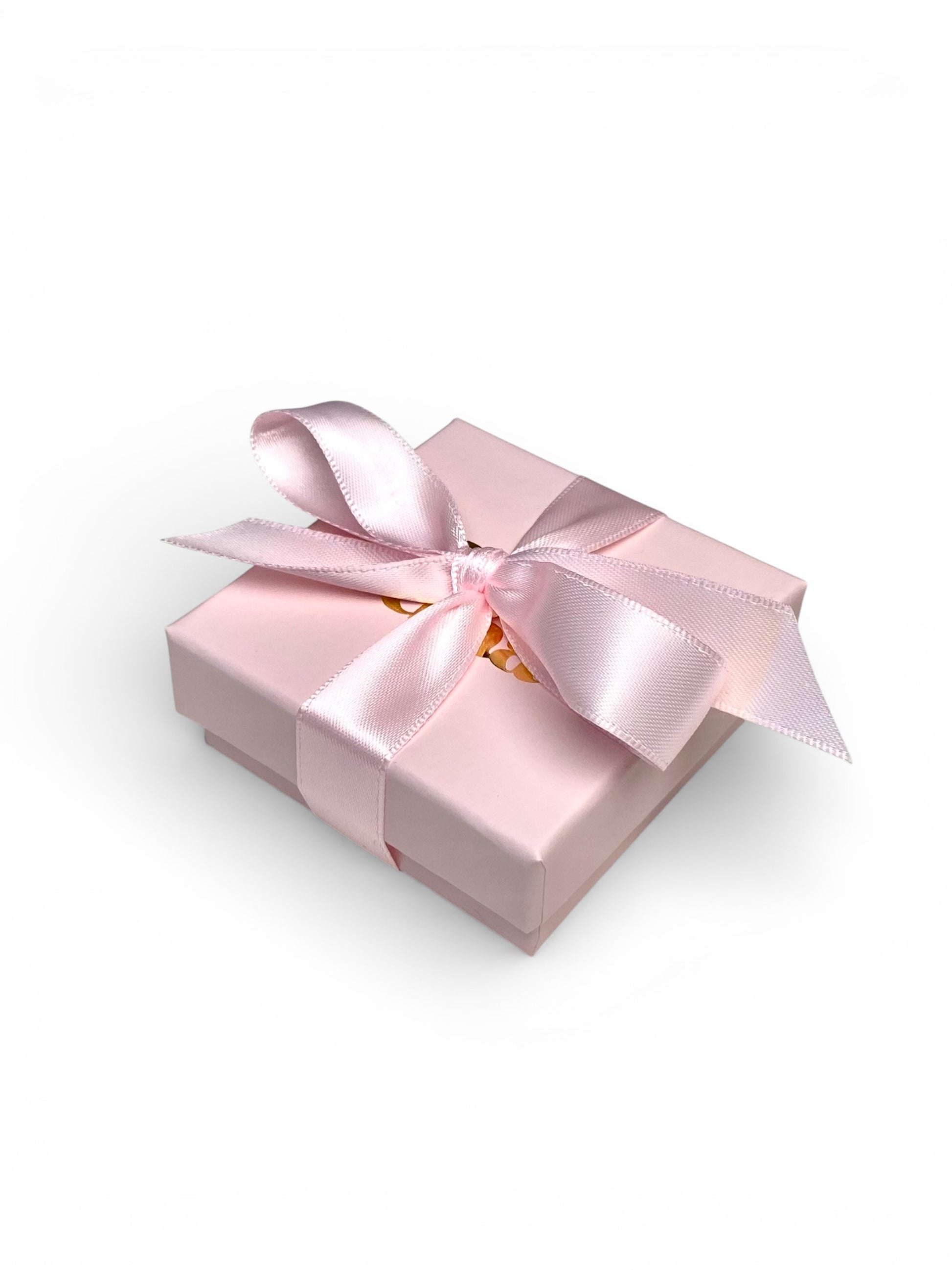 Vaaleanpunainen korurasia rusetilla